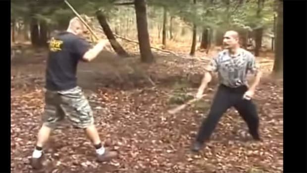 Skilled and brutal MMA-style fight in the woods with sticks - would you?
