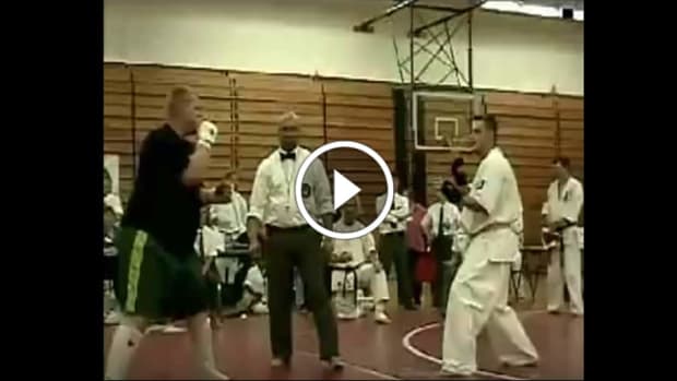 Kyokushin karate vs. HUGE street fighter - ends in 30 seconds