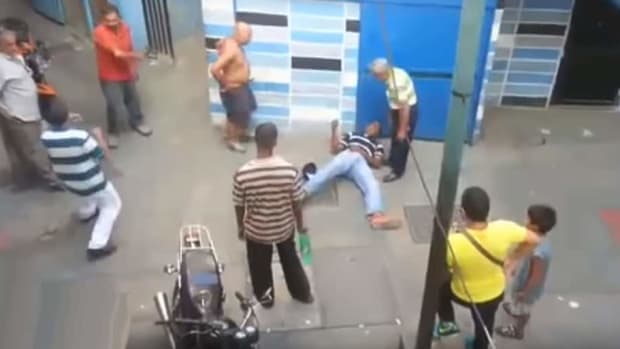 Two attackers swing on an old man; one has a weapon - both take a NAP