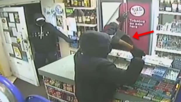 VIDEO: Store owner's wife smashes ax-wielding robber's nose with baseball bat