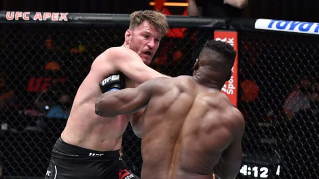 Mar 27, 2021; Las Vegas, NV, USA;  Stipe Miocic punches Francis Ngannou of Cameroon in their UFC heavyweight championship fight during the UFC 260 event at UFC APEX on March 27, 2021 in Las Vegas, Nevada.   Mandatory Credit: Jeff Bottari/Handout Photo via USA TODAY Sports