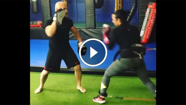 Demi Lovato destroys pads with Cung Le