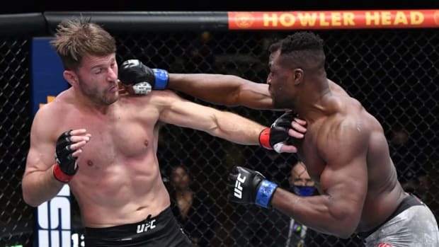 Mar 27, 2021; Las Vegas, NV, USA;   Francis Ngannou of Cameroon punches Stipe Miocic in their UFC heavyweight championship fight during the UFC 260 event at UFC APEX on March 27, 2021 in Las Vegas, Nevada.   Mandatory Credit: Jeff Bottari/Handout Photo via USA TODAY Sports