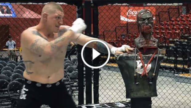 Two pro MMA fighters try to knock out a zombie