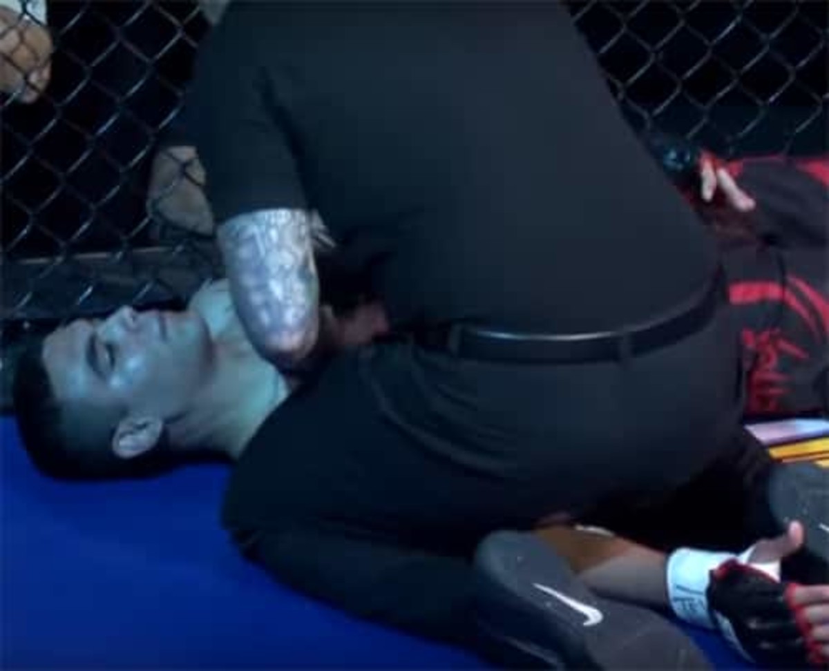 MMA fighter caught with hands down - gets spun to sleep