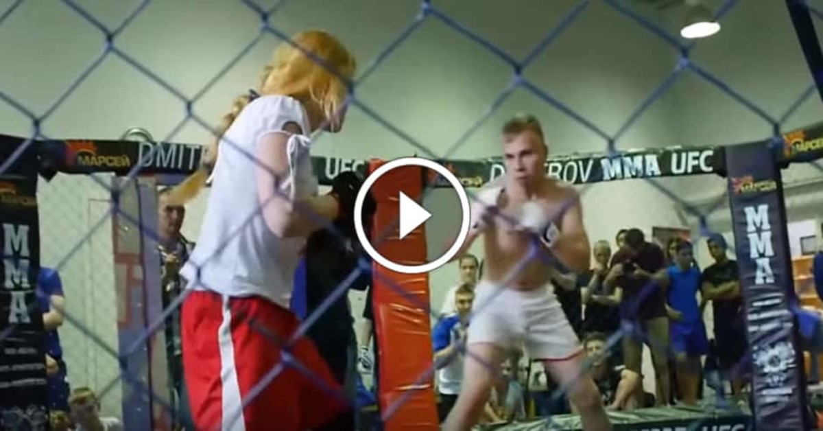 Woman fights man in MMA cage
