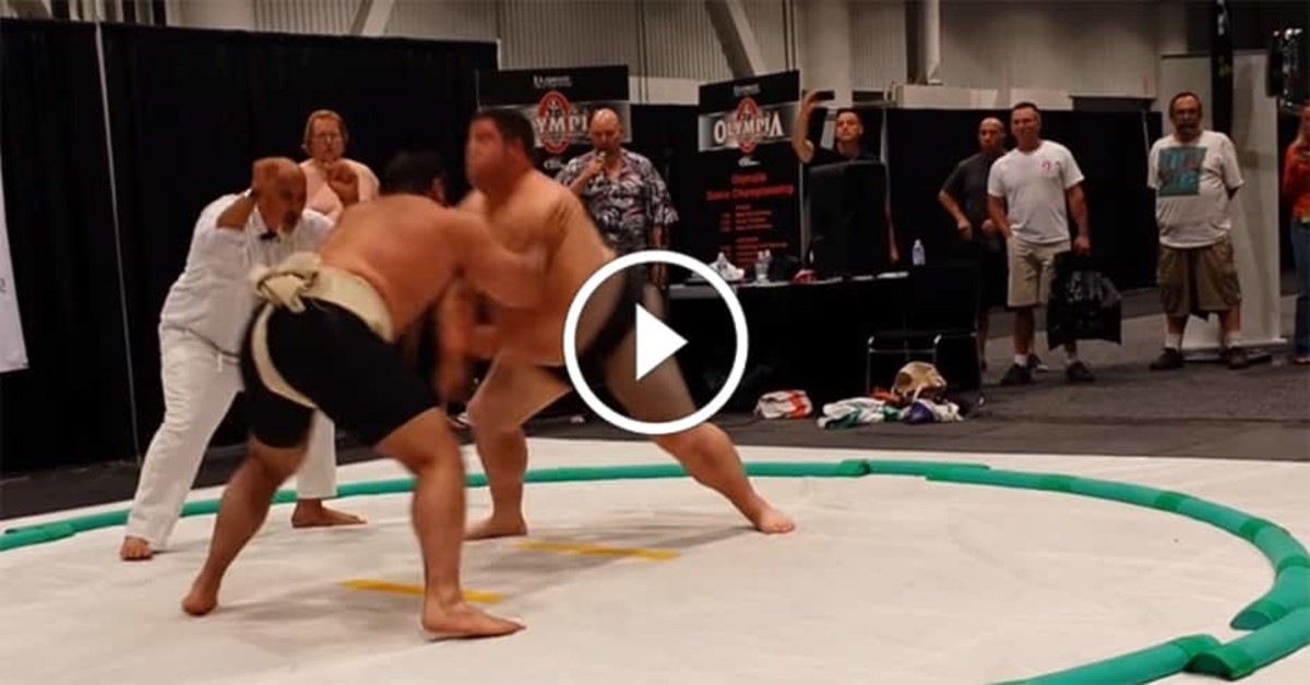 Strongman barrels through sumo wrestler
