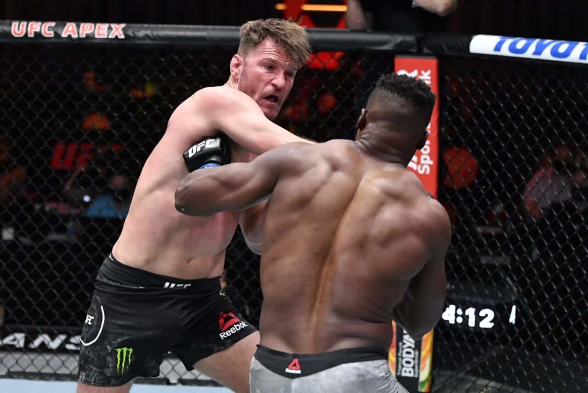 Mar 27, 2021; Las Vegas, NV, USA;  Stipe Miocic punches Francis Ngannou of Cameroon in their UFC heavyweight championship fight during the UFC 260 event at UFC APEX on March 27, 2021 in Las Vegas, Nevada.   Mandatory Credit: Jeff Bottari/Handout Photo via USA TODAY Sports