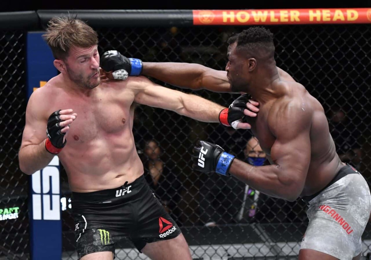 Mar 27, 2021; Las Vegas, NV, USA;   Francis Ngannou of Cameroon punches Stipe Miocic in their UFC heavyweight championship fight during the UFC 260 event at UFC APEX on March 27, 2021 in Las Vegas, Nevada.   Mandatory Credit: Jeff Bottari/Handout Photo via USA TODAY Sports